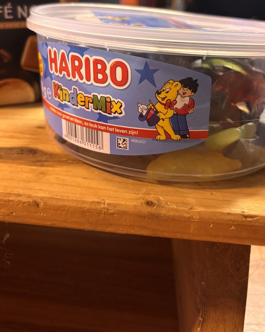 A tub of Haribo KinderMix on a wooden table backstage